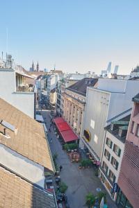 an overhead view of a city street with buildings at Central rooftop apartment with AC and city view in Basel