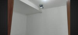 a room with a light on the ceiling at Astiti Ayu Kost Bagirati 2 in Tjakranegara