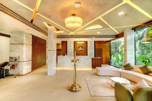 a living room with a couch and a table at PASSIONS HOTEL EDATHUA - Alappuzha in Champakulam