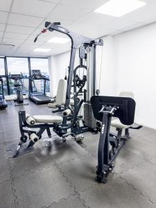 a gym with two treadmills and a treadmill at EasyStay Premier 2BDR Tribute House in Accra +30 photos
