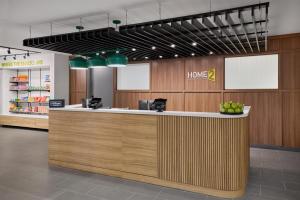 a lobby of a home store with a reception counter at Home2 Suites By Hilton Frankenmuth in Frankenmuth +38 photos