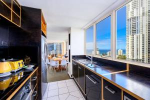 a kitchen with a view of a city skyline at Luxury Views King Ensuite Pool Theatre Mini Golf in Gold Coast