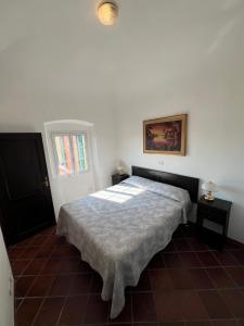 Ένα ή περισσότερα κρεβάτια σε δωμάτιο στο Paradiso sul mare - Finale Ligure