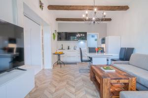 a living room with a couch and a table at Apartmán Alex, Nezábudka in Tatranska Strba