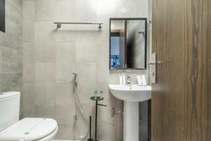 a bathroom with a sink and a toilet and a shower at The Hideout, Khorfakkan in Khor Fakkan +26 photos