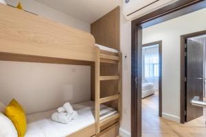 a bedroom with bunk beds in a room at The Hideout, Khorfakkan in Khor Fakkan