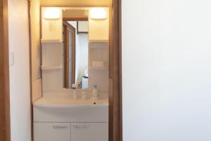 a bathroom with a sink and a mirror at near NAMBA 5min station mireihouse in Wada +32 photos