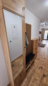 a room with a sliding glass door in a room at Hron River View Apartment 24h Self check -in Free Parking in Banská Bystrica