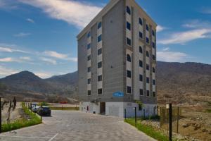 a tall building on the side of a road at The Hideout, Khorfakkan in Khor Fakkan