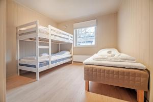 Ένα ή περισσότερα κρεβάτια σε δωμάτιο στο Reinebringen Trail House