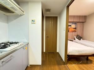 Kuchyň nebo kuchyňský kout v ubytování Sakura Sands Hotel