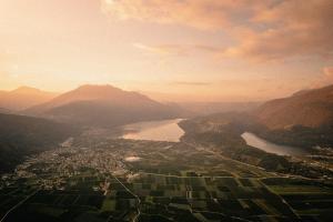 a view of a valley with a river and a city at Cristallo Sport & Wellness Hotel in Levico Terme