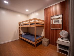 a room with two bunk beds in it at Cozy-SJ-Family Holidays-Work-BBQ-Tea ceremony-Engagement in Subang Jaya