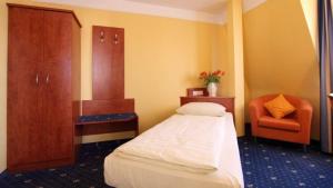 Postel nebo postele na pokoji v ubytování Aparthotel Astro - Nichtraucherhotel