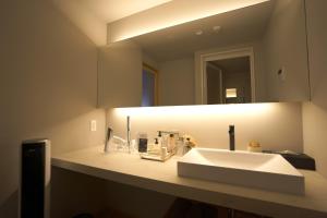 a bathroom with a white sink and a mirror at Mitsuka Building - Vacation STAY 43030v in Kofu