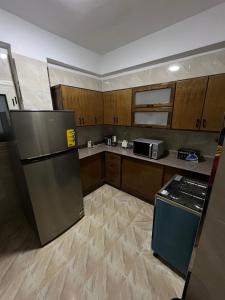 Kuchyň nebo kuchyňský kout v ubytování Tut Apartment