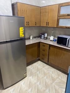 Kuchyň nebo kuchyňský kout v ubytování Tut Apartment + 42 fotografií