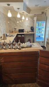 a kitchen with a sink and a counter top at Lamar 1 furnished Aparthotel in Riyadh