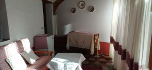 a living room with a couch and a table at B&B Casa Licheri in San Vito