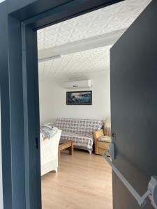 a view of a living room with a couch at DİDİM Ege Apart in Didim