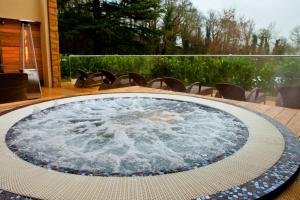 a hot tub on a table in a patio at DoubleTree by Hilton Bristol South - Cadbury House in Yatton