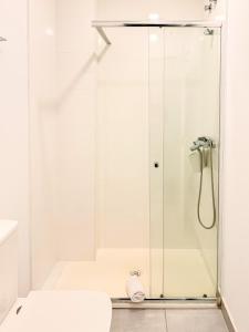 Ένα μπάνιο στο Sanxenxo Playa Alojamientos