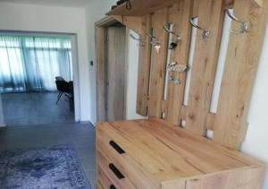 a wooden cabinet in a room with a door at Attila Beach Boglár in Balatonboglár