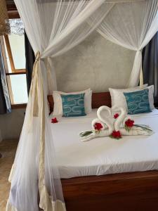 Postel nebo postele na pokoji v ubytování Salida Beach Zanzibar