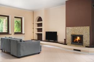 Posezení v ubytování Golden Villas - Cozy Family Villa with Garden & Sauna, Konstancin