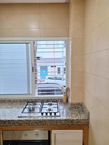 Kuchyň nebo kuchyňský kout v ubytování bel appartement