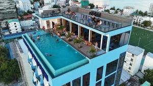 an overhead view of a building with a swimming pool at iCom Blue Seaview in Maafushi