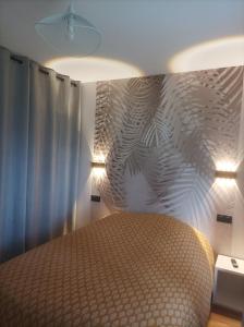 Ένα ή περισσότερα κρεβάτια σε δωμάτιο στο L'émeraude