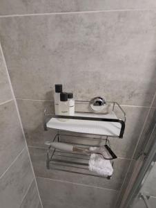 a bathroom with two towel racks on the wall at Primrose cottage - Upper cwmbran in Pontnewydd +60 photos