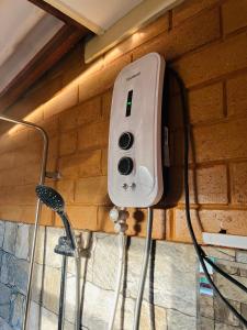 a soap dispenser hanging on a brick wall at Florance Nice Hotel Weligama in Weligama +32 photos