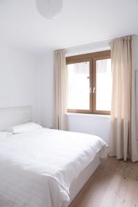 Postel nebo postele na pokoji v ubytování Residence Margerithenweg - Kärnten Card Sommer 2025 inklusive