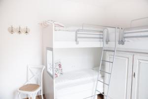 a room with bunk beds and a ladder at Residence Margerithenweg in Bad Kleinkirchheim