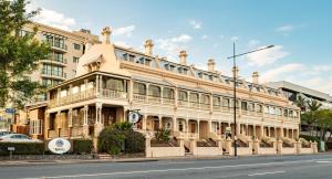 a large building on the side of a street at Cosmo Apartment Hotel in Brisbane
