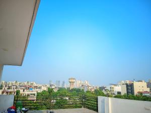 a view of a city skyline from a balcony at Expo Mart Inn in Greater Noida