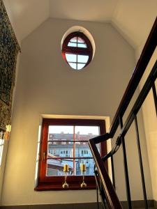 a stairway with a window and a stair railing at Stara Kamienica in Szczytno