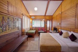 Postel nebo postele na pokoji v ubytování RoseDew Villa