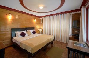 Postel nebo postele na pokoji v ubytování RoseDew Villa