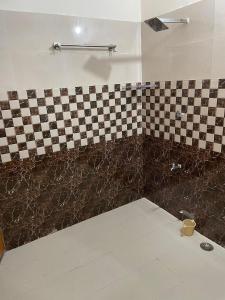 Ένα ή περισσότερα κρεβάτια σε δωμάτιο στο Atulyam villa near Lucknow junction