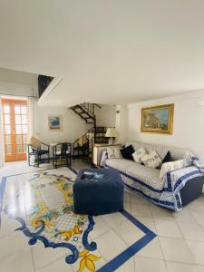 a living room with a bed and a rug at Center Apartment Capri in Capri