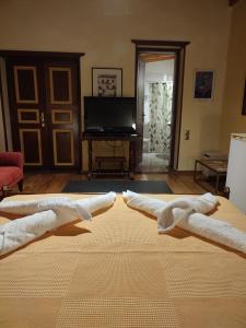 Μια τηλεόραση ή/και κέντρο ψυχαγωγίας στο The Wooden Nest, Cozy Private Room