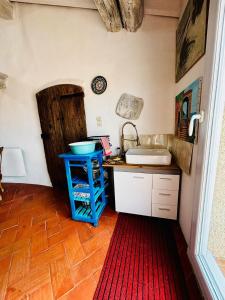 a kitchen with a counter and a sink in a room at Loft vue Canigou - Maureillas in Maureillas +37 photos