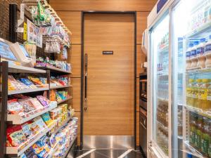 a door in a grocery store aisle with food at APA Hotel Asakusa Kaminarimon Minami in Tokyo +50 photos