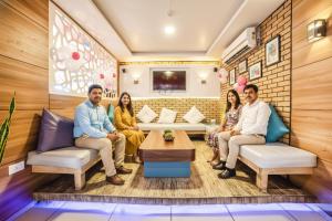 a group of people sitting in a room at FabHotel Imperio - Nr Baner Hill in Pune