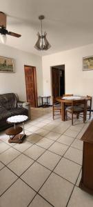 a living room with a couch and a table at Casa LV 2 in Lençóis