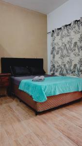 Ένα ή περισσότερα κρεβάτια σε δωμάτιο στο Pousada Praia do Sol 03