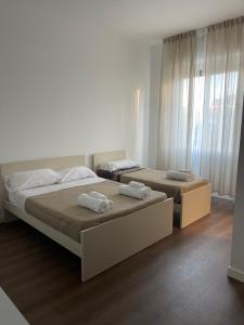 Postel nebo postele na pokoji v ubytování amoR Tempora